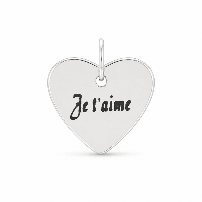 Les Paulinas, charm cœur « Je t'aime » argenté en acier inoxydable Charm cœur avec inscription « Je t'aime » argenté en acier inoxydable pour bijou personnalisable Les Paulinas