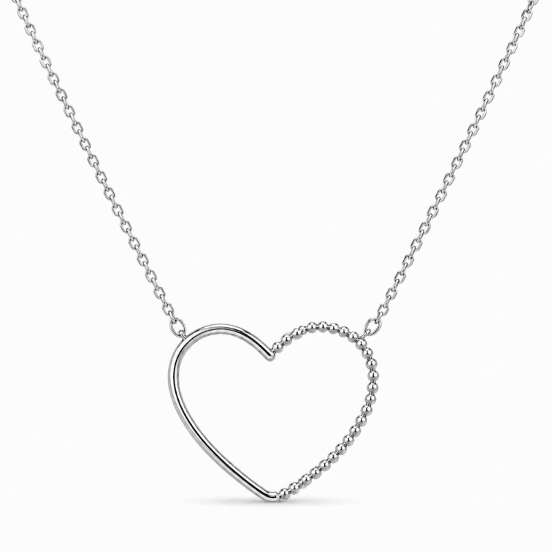 Les Paulinas, collier Paulina Précieuse argenté en acier inoxydable Collier Paulina Précieuse argenté en acier inoxydable avec pendentif cœur bicolore de textures, pour bijoux Les Paulinas