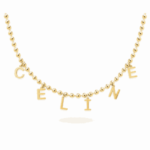 Collier personnalisable doré inspiré de Céline Dion avec les lettres C E L I N E sur une chaîne Paulina Audacieuse Les Paulinas